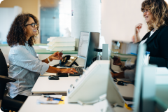 lady looking at computers at a desk