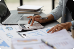 hand typing on a calculator